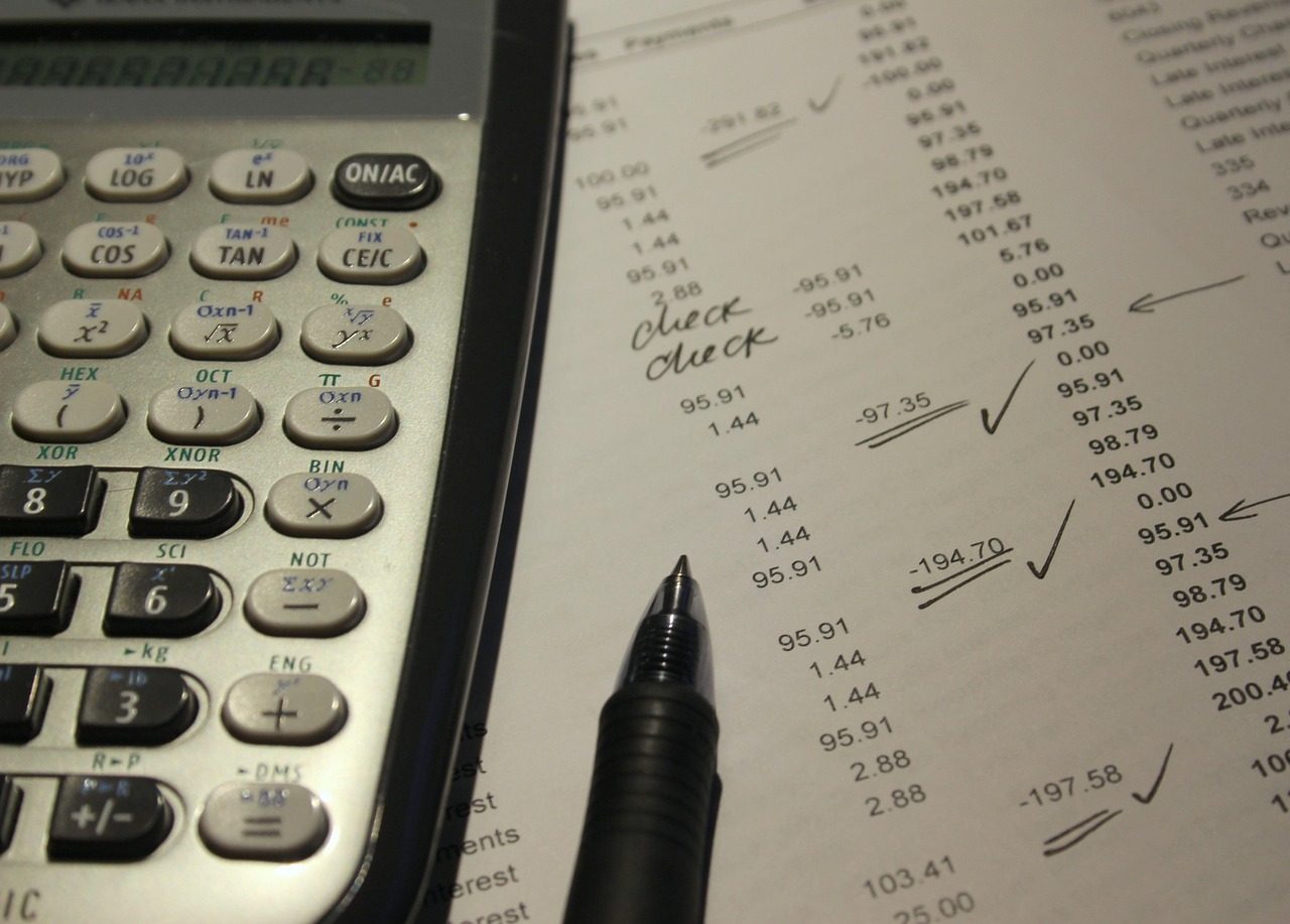 A calculator resting on a printed statement