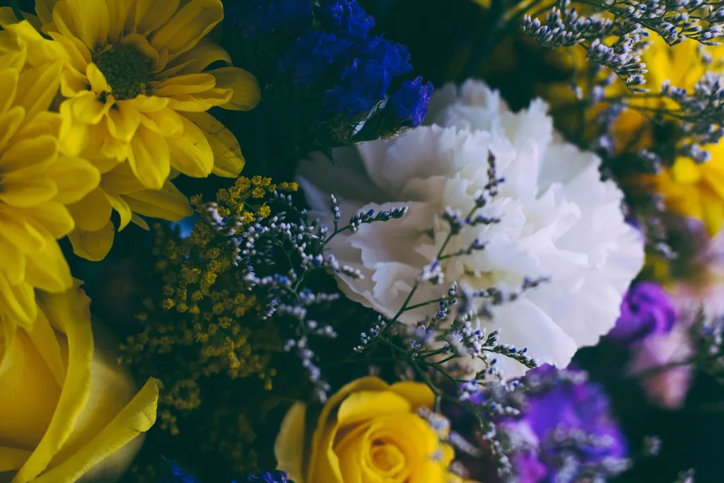 Close on a mixed bouquet, petals and stamens filling the frame.